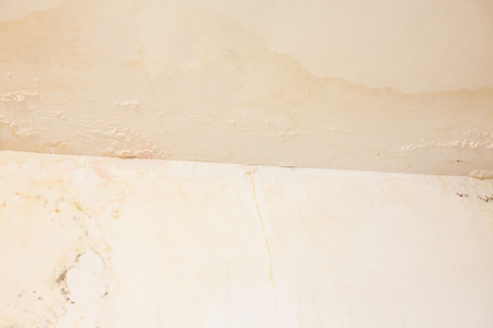 Dirt watery ceiling leaking view indicating dangerous of flood and mold growの写真素材
