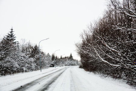 Beautiful and dangerous driving road in winter snow Icelandの写真素材