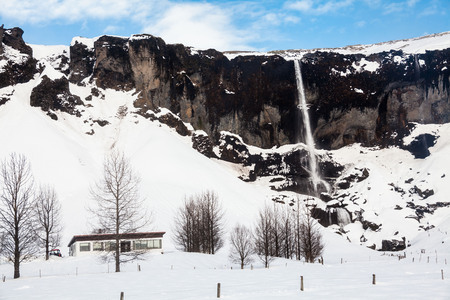 Foss a Sidu waterfall view during winter snow in Kirkjubaejarklaustur, Icelandの写真素材
