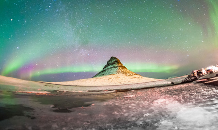 Kirkjufell view during winter snow which is a high mountain on the north coast of Iceland's Snaefellsnes peninsula, near the town of Grundarfjordurの写真素材