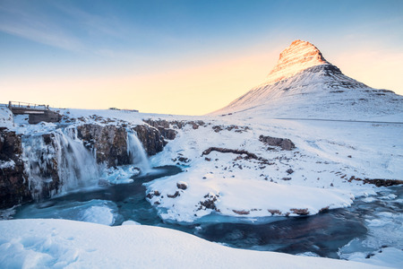 Kirkjufell view during winter snow which is a high mountain on the north coast of Iceland's Snaefellsnes peninsula, near the town of Grundarfjordurの写真素材