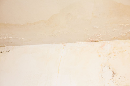 Dirt watery ceiling leaking view indicating dangerous of flood and mold growの写真素材