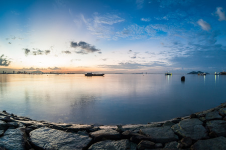 Sunrise or sunset landscape view by the shore for beautiful backgroundの写真素材