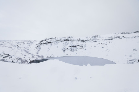 Kerid volcano crater during winter snow in Icelandの写真素材