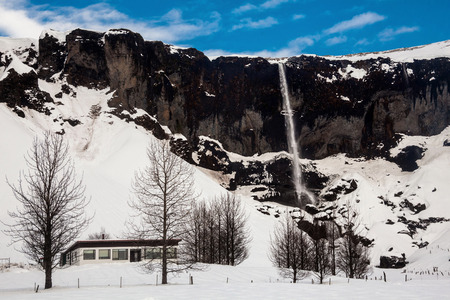 Foss a Sidu waterfall view during winter snow in Kirkjubaejarklaustur, Icelandの写真素材