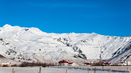 Eyjafjallajokull volcano with blue sky view during winter snow, Icelandの写真素材
