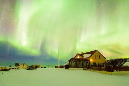 Aurora Borealis or better known as The Northern Lights for background view in Iceland, Snaefellsnesvegur during winterの写真素材