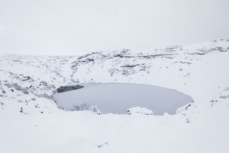 Kerid volcano crater during winter snow in Icelandの写真素材