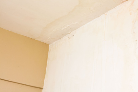 Dirt watery ceiling leaking view indicating dangerous of flood and mold growの写真素材