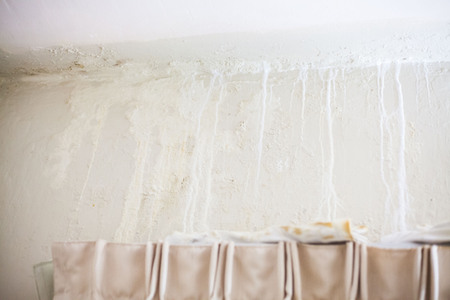 Dirt watery ceiling leaking view indicating dangerous of flood and mold growの写真素材