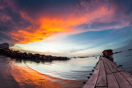 Wooden bridge Clan Tan Jetty view during sunrise in George Town, Penangの写真素材