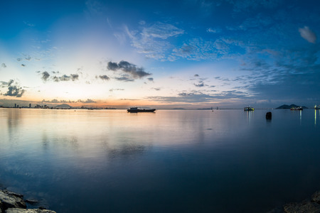 Sunrise or sunset landscape view by the shore for beautiful backgroundの写真素材