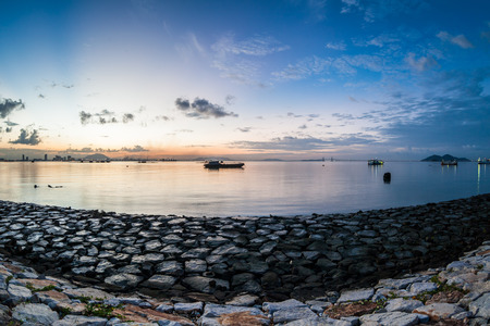 Sunrise or sunset landscape view by the shore for beautiful backgroundの写真素材