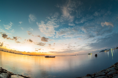 Sunrise or sunset landscape view by the shore for beautiful backgroundの写真素材
