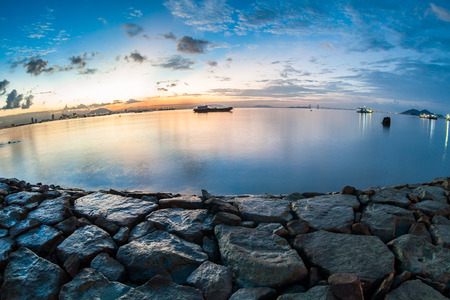 Sunrise or sunset landscape view by the shore for beautiful backgroundの写真素材