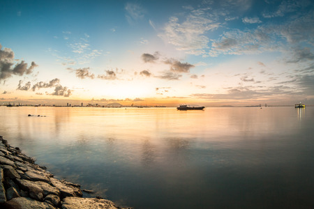 Sunrise or sunset landscape view by the shore for beautiful backgroundの写真素材