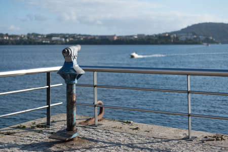 Santa Comba Ferrol Galicia Galicia sunny sky with rocks near to sea with empty parking area sunset...