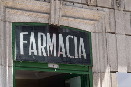 Ferrol / Galicia / Spain - 08 08 2020: Old pharmacy in spanish front store sign with no brand nameのeditorial素材