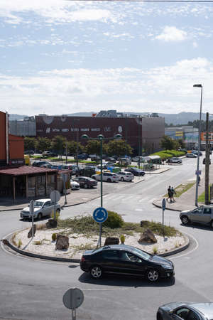 Ferrol, Galicia, Spain - 08 20 2020: Roundabout traffic at commercial district of A Gandara with...