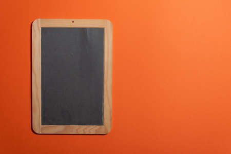 Blank portable blackboard for adding chalk text and copy space. Old school objects for educative aesthetics presentation template. Right side copy space for design or logosの写真素材