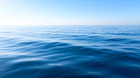 Calm blue ocean under clear skyの素材
