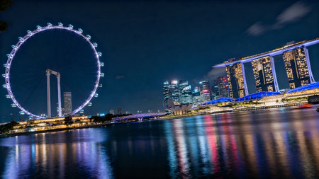 Singapore Flyer at Marina Bay, Singapore, at night.の素材