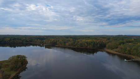 Aerial panoramic view of river and forest in autumn.の写真素材