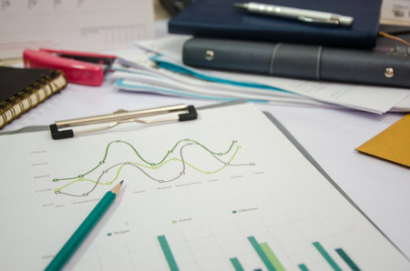 Graphs and Charts on the desk of Businessman working.の写真素材