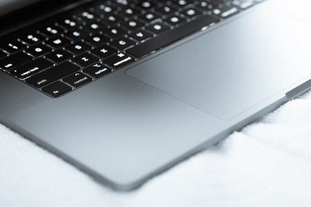 Close up of a laptop on a white background. Toned.