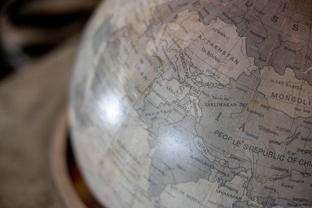 Close up of a globe on a wooden table in a museum.の写真素材