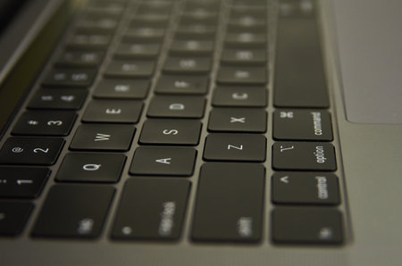 Close up of a black laptop keyboard with shallow depth of field.