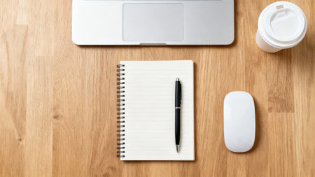 Office desk table with laptop, notebook and coffee cup. Top view with copy spaceの素材