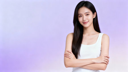 Portrait of a young asian woman standing on a purple backgroundの素材