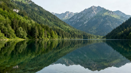 Beautiful mountain lake in the Alps. Reflection in water.の素材