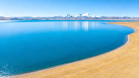 Mountain lake with snow peaksの素材