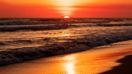 Beautiful sunset on the beach. Sea, sand, waves.の素材