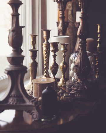 Vintage candlesticks and candlesticks on the windowsillの写真素材