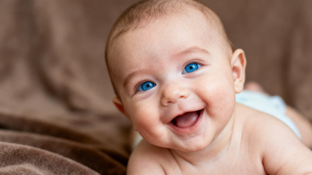 Smiling baby with blue eyesの素材