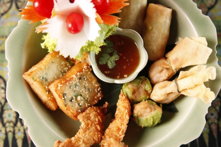 Thai favourites with spring roll vegetable and shrimp tempura.の写真素材