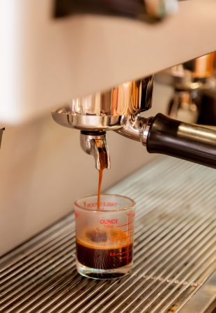 A cup of coffee from the machine .の写真素材