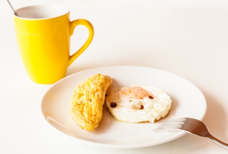  Breakfast consisting coffee , fried eggs and omelette  の写真素材