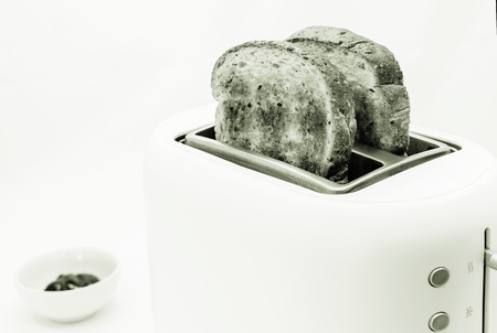 Toasted bread and toaster for breakfast の写真素材