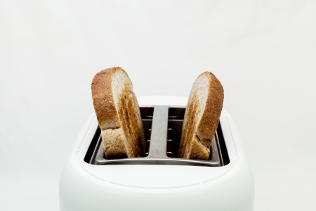 Toasted bread and toaster for breakfast.