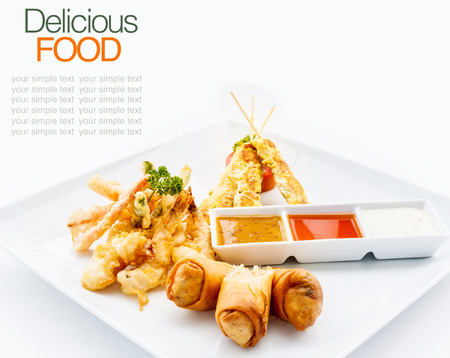 Thai favourites with spring roll vegetable,chicken satay,shrimp tempura.の写真素材