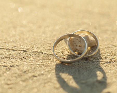 Wedding rings put on the beachside.の写真素材
