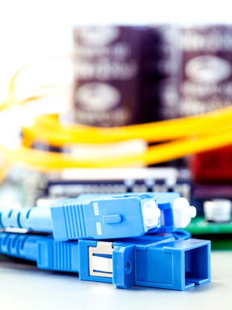 Closeup of fiber optic connector with Circuits board