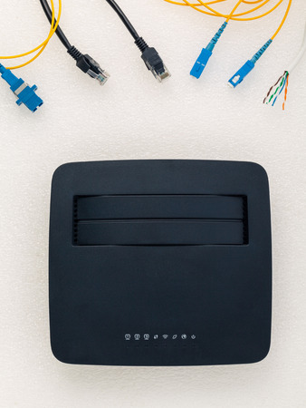 Above view of telecommunication connector with black router.の写真素材