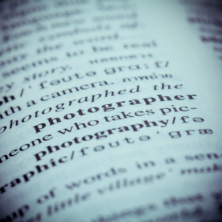 Close up of old English dictionary page with word Photographer. Shallow depth of field and toned page of word Photographer on English dictionary .
の写真素材