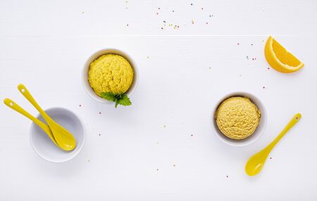Various of ice cream flavor lemon and orange set up on white woodenの写真素材