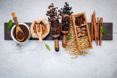 Roasted coffee beans with coffee powder and flavourful ingredients for make tasty coffee setup on...